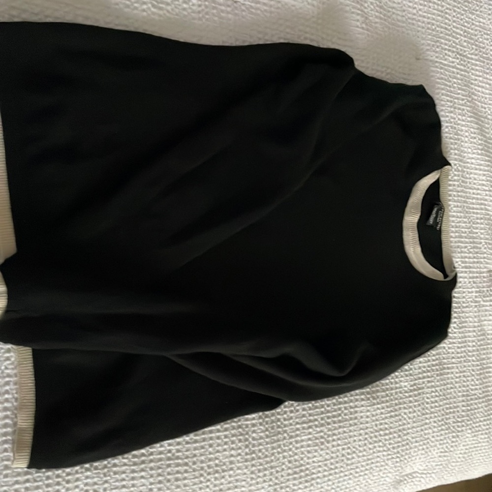 Cashmere sweater with white trim around the collar